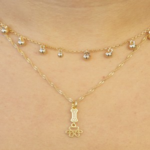  PINGENTE PET OSSINHO COM ZIRCONIAS BRANCAS E PATINHA VAZADA COM  BANHO DE OURO BRANCO. SEMI JOIA